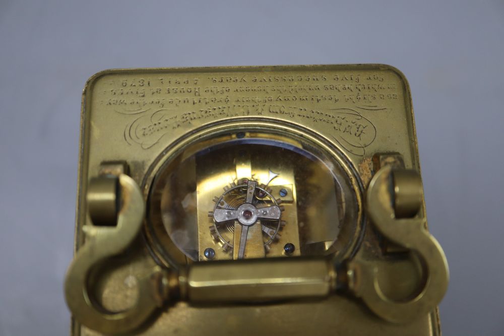 A late 19th century brass carriage timepiece, engraving to the top plate